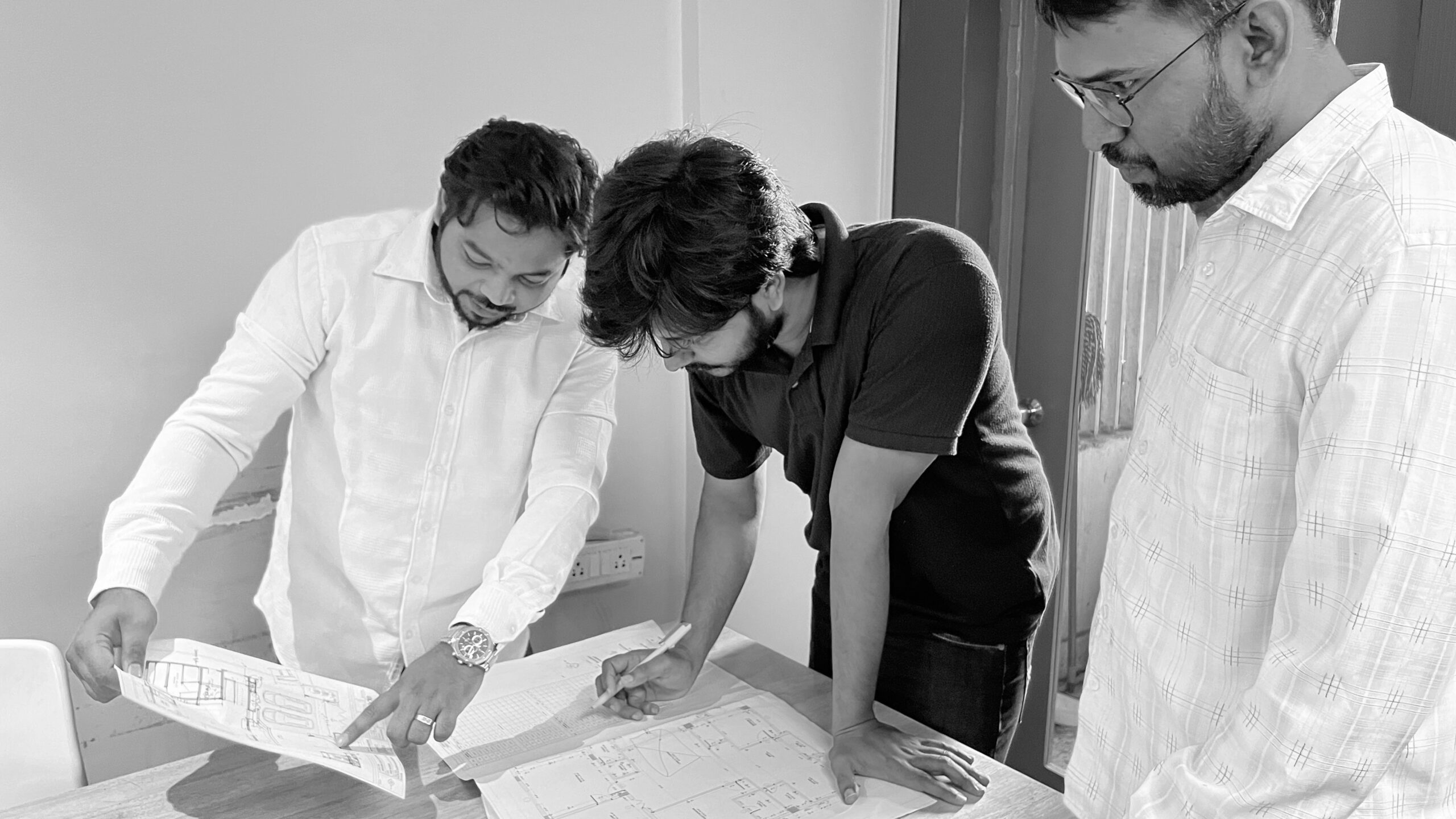 Team meeting around a shared monitor